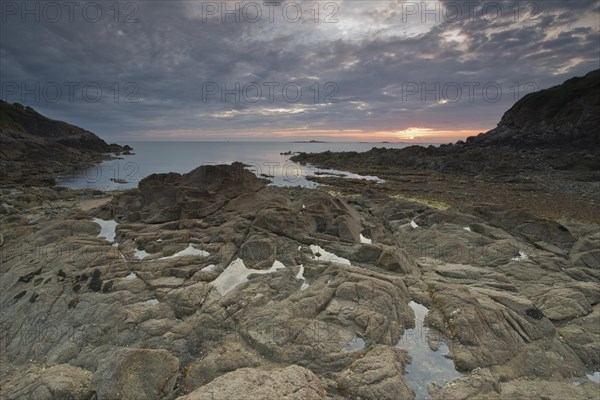 Sunrise on the rocky beach