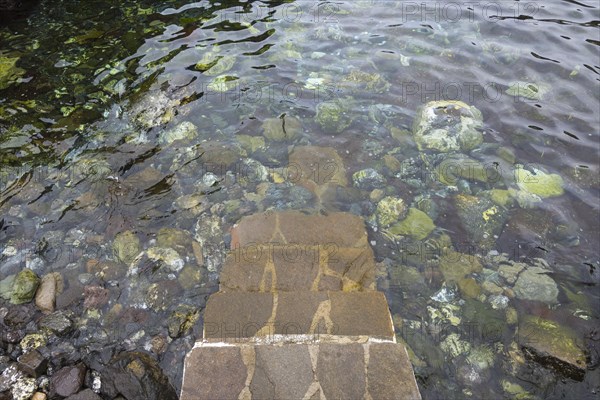 Stairs to natural swimming pool