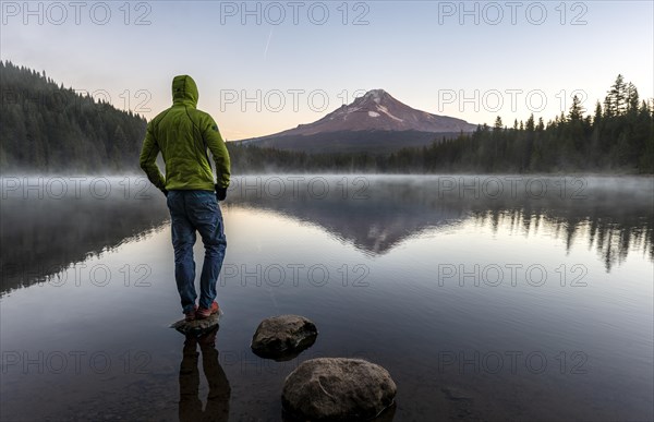 Young man standing on stone
