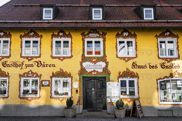 Yellow facade with paintings