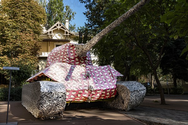 Tank wrapped in fabric with Hello Kitty print