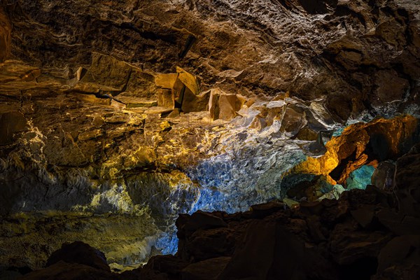 Colourfully illuminated areas of the Cueva de los Verdes