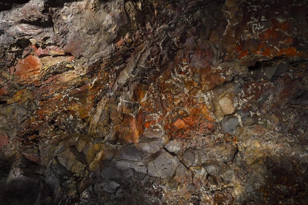 Colourfully illuminated areas of the Cueva de los Verdes