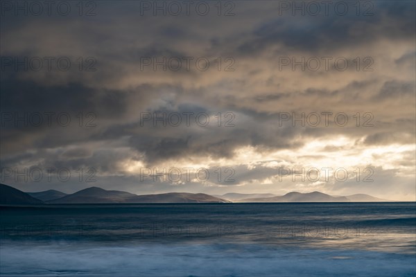 North Atlantic with rock needle and cloudy sky