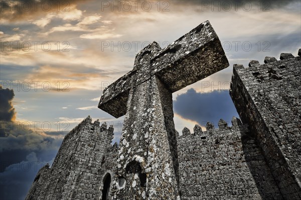 Cross next to castle walls