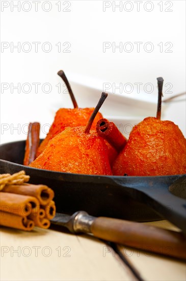 Poached pears delicious home made recipe ove white rustic wood table