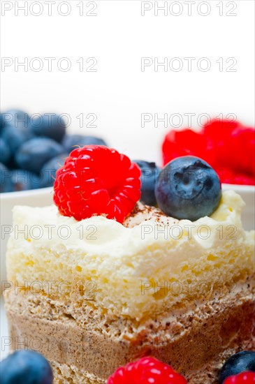 Fresh homemade raspberry and blueberry cream cake
