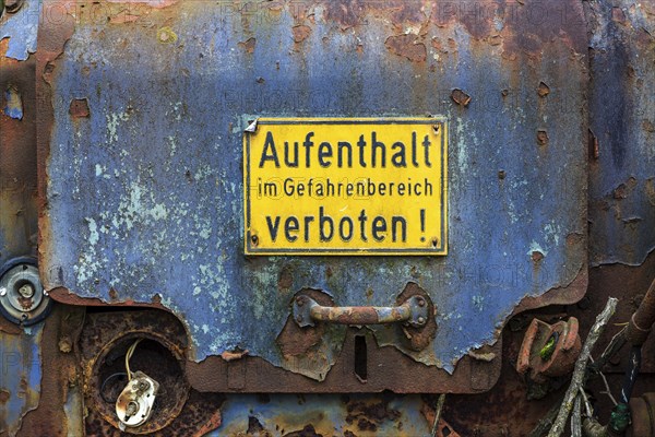Prohibition sign on old machine door