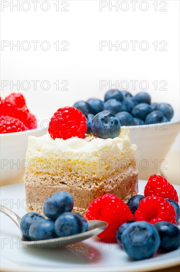 Fresh homemade raspberry and blueberry cream cake