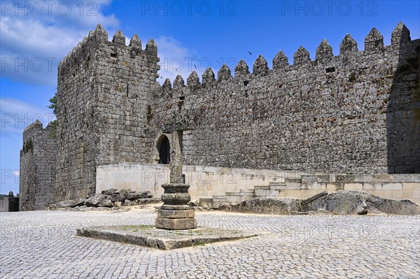 Cross next to castle walls