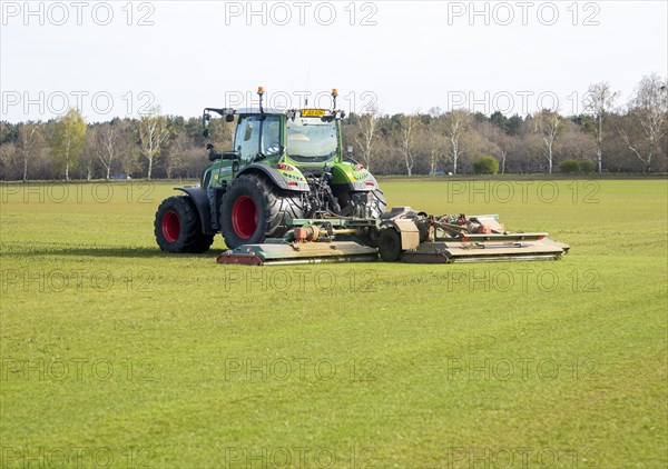 Fendt 313 tractor mowing grass
