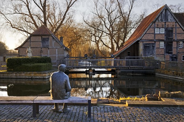 Bronze sculpture of the local poet Paul Advena at the water mill in Heek-Nienborg