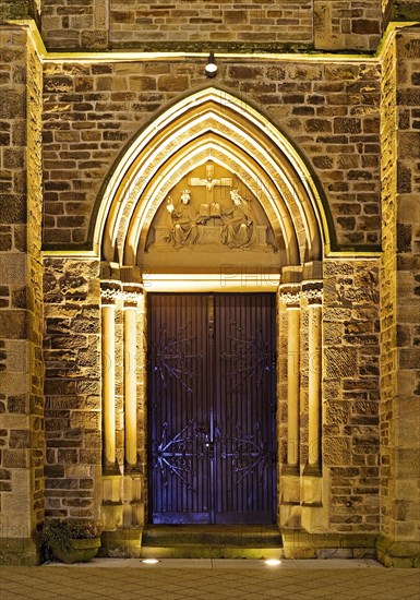 Illuminated entrance to the parish church of St. Suitbertus