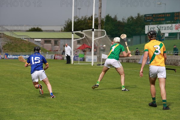 GAA player with hurley and ball during a game as Lixnaw win Kerry county hurling county final