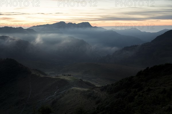 Fog in the high valley on an autumn evening at Potlakopf