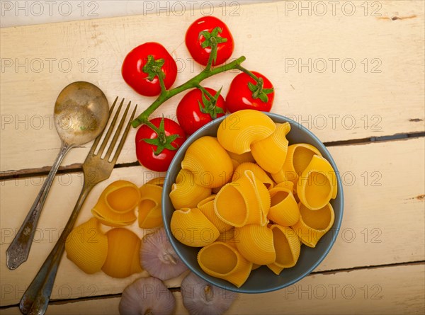 Italian snail lumaconi pasta with ripe cherry tomatoes sauce ingredients