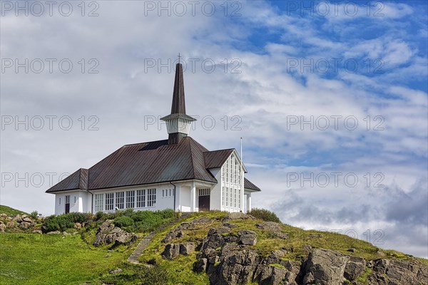 Holmavikurkirkja on hill in summer