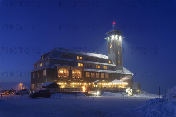 Fichtelberghaus on the summit of Fichtelberg at dusk in winter
