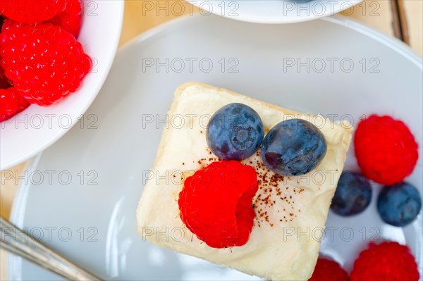 Fresh homemade raspberry and blueberry cream cake
