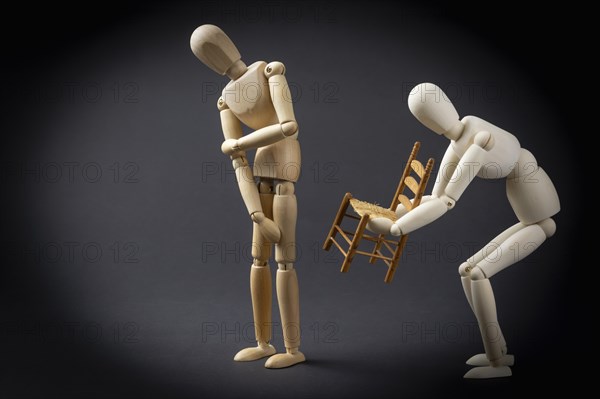 The mannequin hands over the chair
