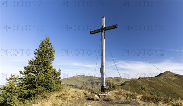 Summit cross in the morning light on Portlakopf