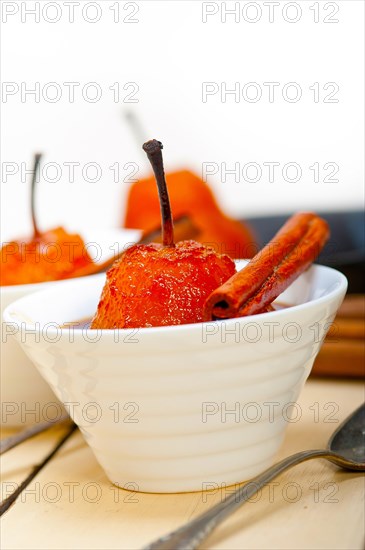 Poached pears delicious home made recipe ove white rustic wood table