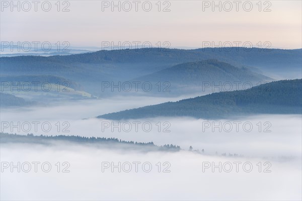 View from Katzenbuckel mountain with morning mist