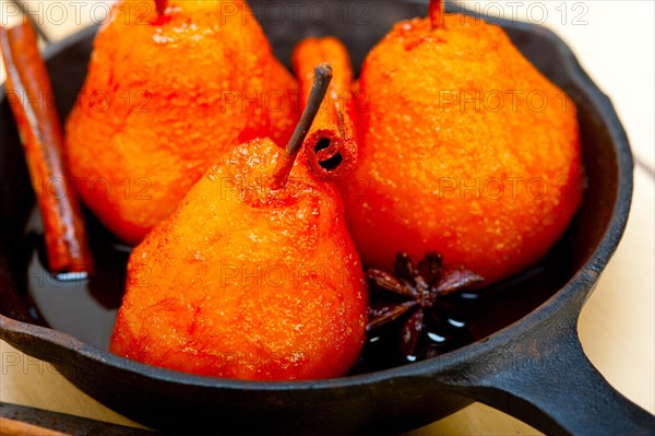Poached pears delicious home made recipe ove white rustic wood table