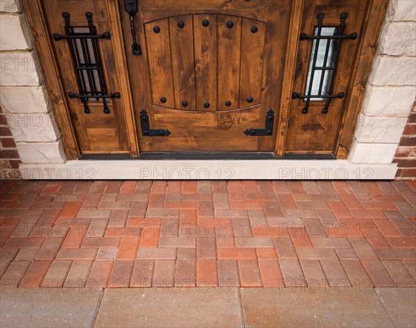 Front door of a house without doormat