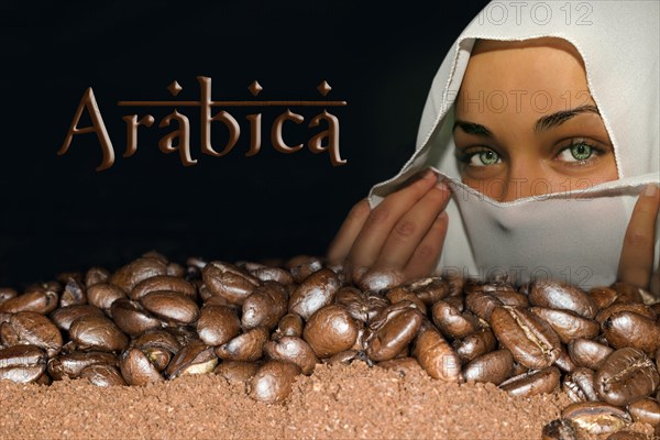 Coffee beans of the Arabica variety lying on ground coffee