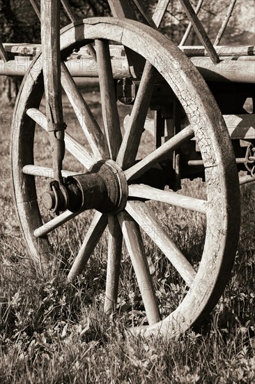 Wooden wheel on an old wooden cart