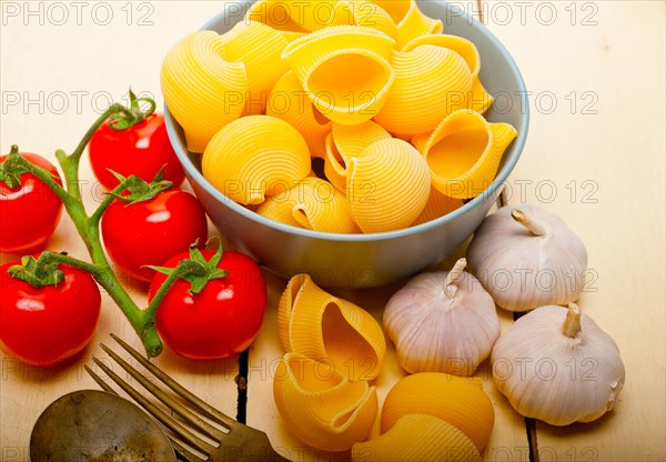 Italian snail lumaconi pasta with ripe cherry tomatoes sauce ingredients