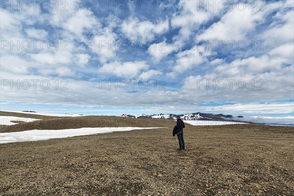 Tourist on stony plateau
