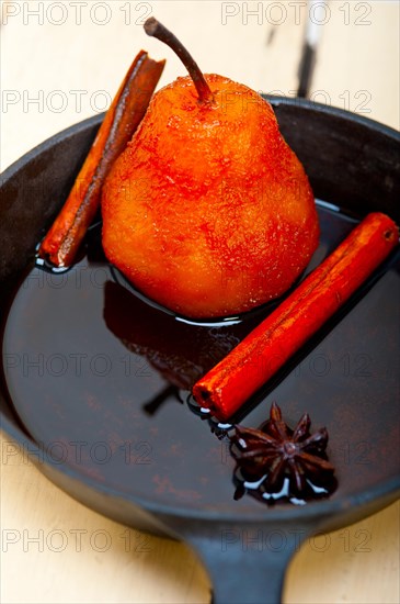 Poached pears delicious home made recipe ove white rustic wood table