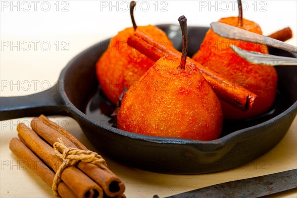 Poached pears delicious home made recipe ove white rustic wood table
