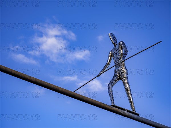 Stainless steel sculpture 'Walking Man' by the Frankfurt artist E. R. Nele above Friedberger Strasse
