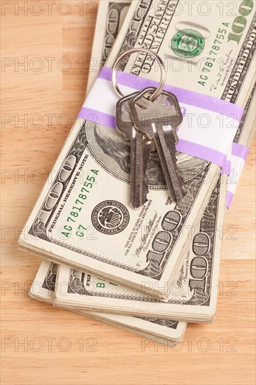 House keys on stack of money