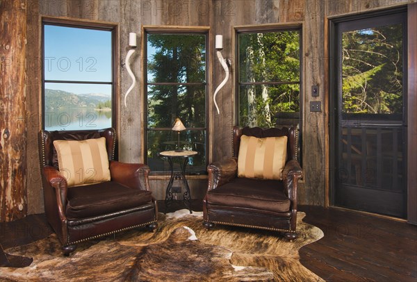 Luxurious rustic reading room in rural setting with lake view