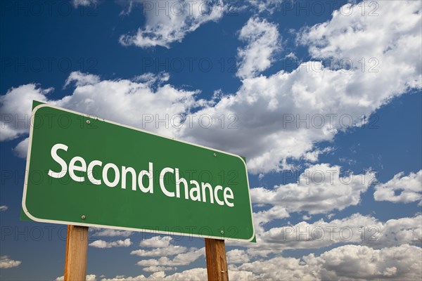 Second chance green road sign and dramatic clouds background