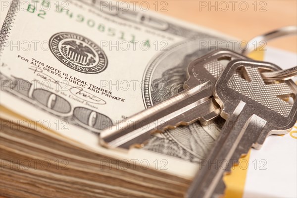 House keys on stack of money