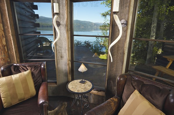 Luxurious rustic reading room in rural setting with lake view