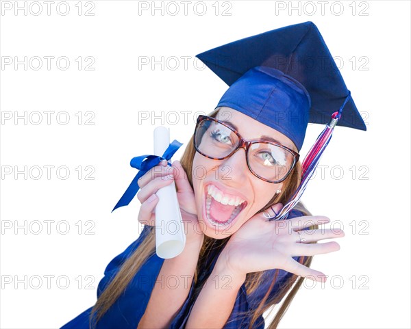 Goofy graduating young girl in cap and gown isolated on a white background