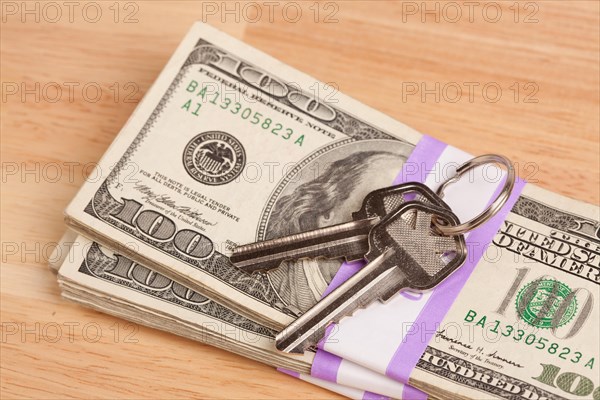House keys on stack of money