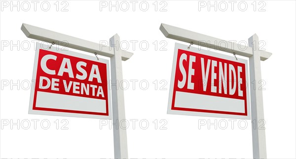 Two spanish house for sale real estate signs with clipping paths isolated on a white background