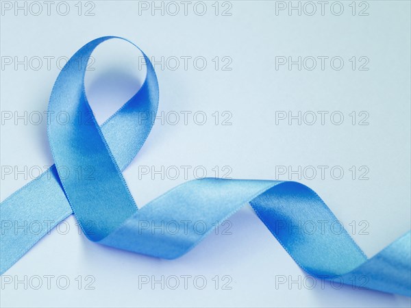 Above view cancer concept with blue ribbon
