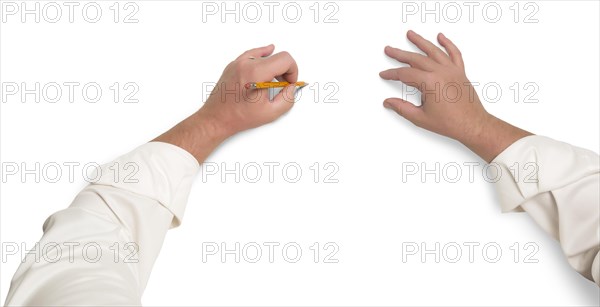 Male hands sketching with pencil on white background