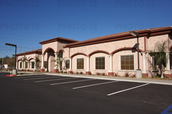 New vacant retail building and empty parking lot