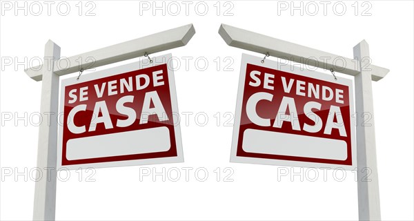 Two spanish house for sale real estate signs with clipping paths isolated on a white background