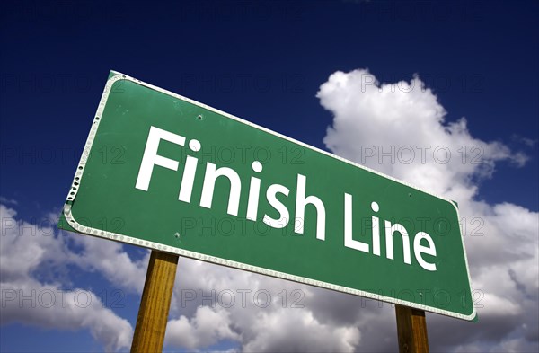 Finish line road sign with dramatic clouds and sky