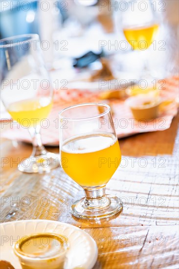 Abstract of small glass of micro brew beers on bar